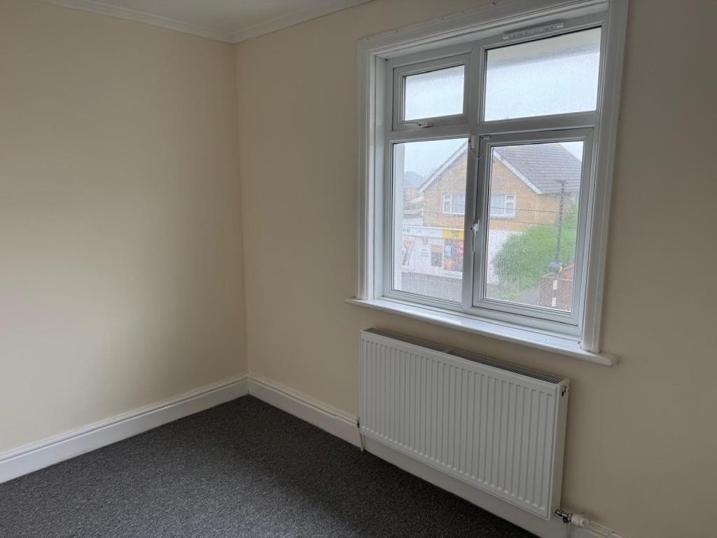 Lot: 93 - FIRST FLOOR FLAT FOR INVESTMENT - second bedroom with carpet and magnolia wall
